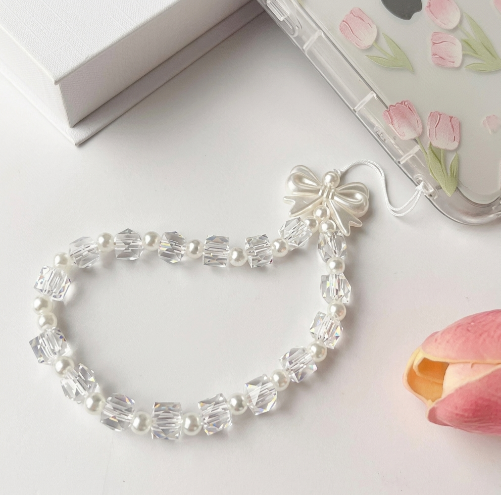 Crystal Elegance: Handcrafted Diamond-Cut Phone Charm with Pearl Bow